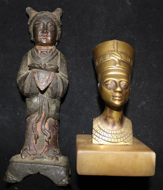 A figure of Kwan Yin and an Egyptian head paperweight